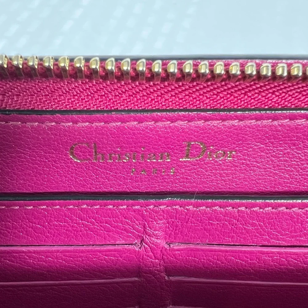1009: Christian Dior Pebbled Leather Zip Continental Wallet, Fuchsia Int